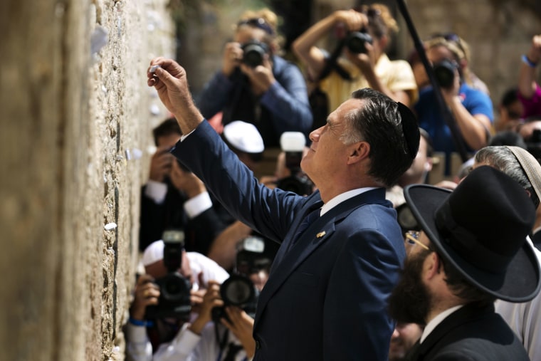Republican presidential candidate Mitt Romney places a message written on paper in the ancient stones of the Western Wall in Jerusalem's Old City on July 29, during the annual Ninth of Av fasting and memorial day, commemorating the destruction of ancient temples in Jerusalem. Romney is meeting Israeli leaders as he seeks to burnish his foreign policy credentials and portray himself as a better friend to Israel than President Barack Obama.