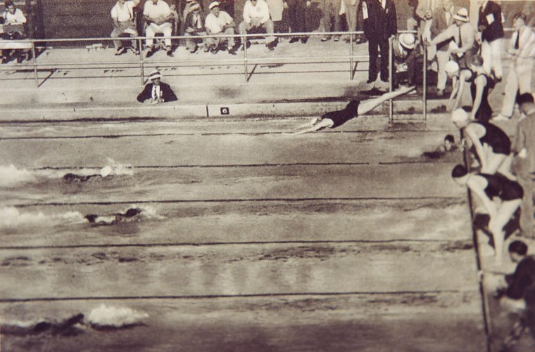 Helen Johns Carroll dives into the pool in the second leg of the winning 400-meter relay at the 1932 Olympics in Los Angeles.