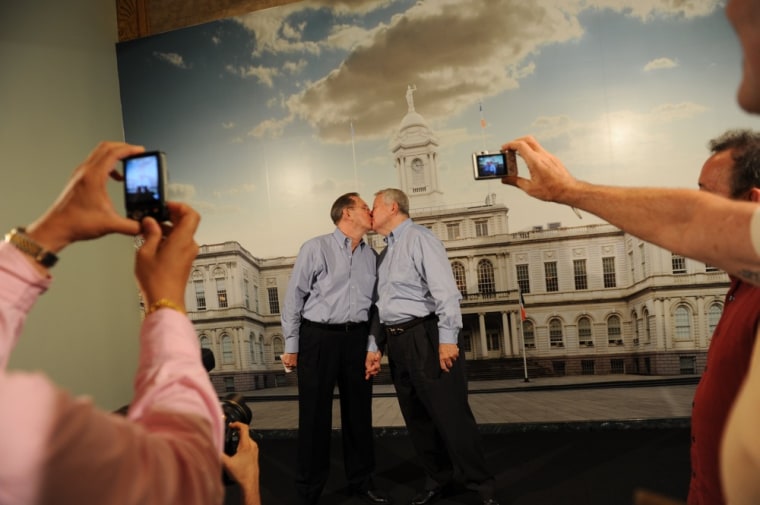 Same-sex couple Ray Durand (L) and his partner Dale Shields kiss while having their picture taken after their wedding ceremony at the Manhattan City Clerk's office on the first day New York State's Marriage Equality Act goes into effect July 24, 2011 in New York City.