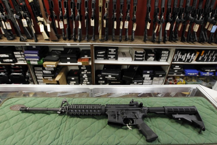 An AR-15 style rifle is displayed at the Firing-Line indoor range and gun shop on July 26, 2012 in Aurora, Colo.
