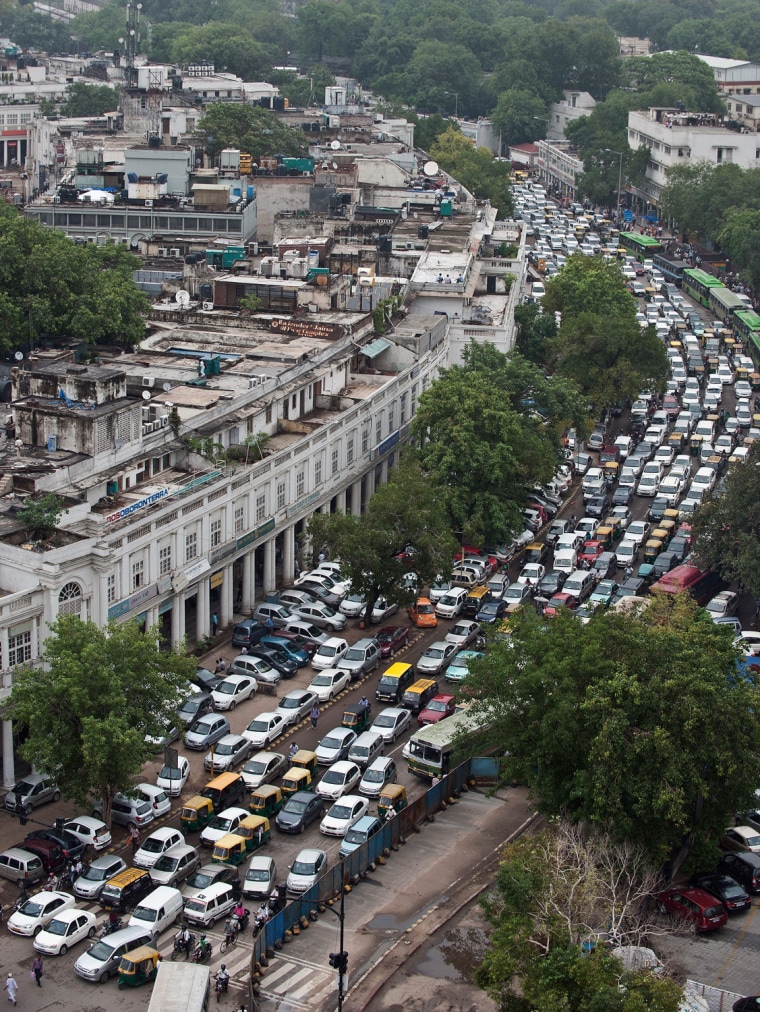 Traffic crawls in Connaught Place in New Delhi July 31, as the situation worsened in the afternoon after signals stopped functioning following a failure in the Northern Power Grid. A massive power failure hit India for the second day running as three regional power grids collapsed, blacking out more than half the country in a crisis affecting over 600 million people.