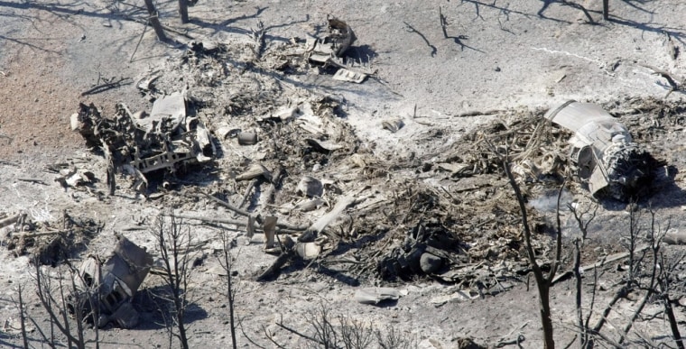 The crash scene of a heavy air tanker is seen from the air, June 4, 2012, near Hamblin Valley Utah. The P2v Heavy air tanker crashed Sunday afternoon, killing pilots Todd Neal Tompkins and Ronnie Edwin Chambless, both of Boise, Idaho.