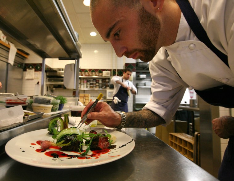 Douglas Rodrigues, chef de cuisine at Clio restaurant in Boston, prepares the duet du boeuf dish.