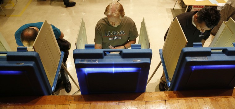 Voters cast their ballots on June 5, in Milwaukee. Wisconsin Republican Gov. Scott Walker is taking on Democratic challenger Tom Barrett in a recall election.