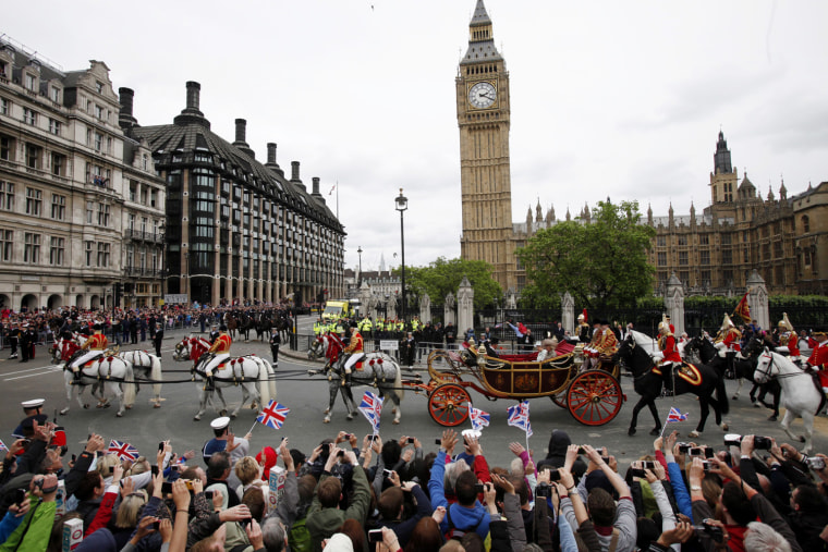 Britain's Queen Elizabeth II, Camilla Duchess of Cornwall and Prince Charles are seen in the State Landau carriage when they pass The Houses of Parliament and Big Ben during the Carriage Procession from Westminster Hall to Buckingham Palace in London, Britain, on June 5.