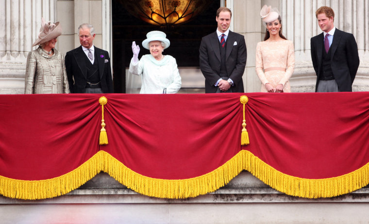 Camilla, Duchess of Cornwall, Prince Charles, Prince of Wales, Queen Elizabeth II, Prince William, Duke of Cambridge Catherine, Duchess of Cambridge and Price Harry wave to the crowds from Buckingham Palace during the Diamond Jubilee carriage procession after the service of thanksgiving at St.Paul's Cathedral on the Mall on June 5, in London, England.