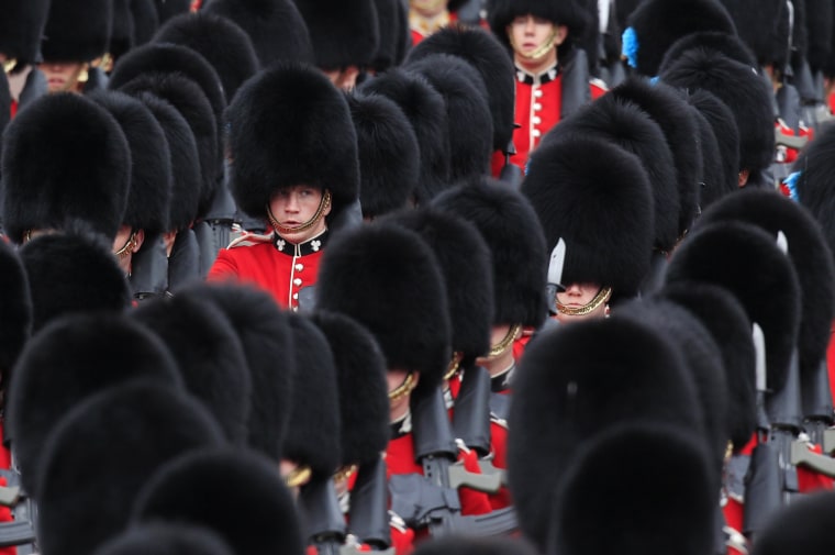 Guards arrive at Buckingham Palace ahead of a horse-drawn carriage procession carrying Queen Elizabeth and the royal family in London on June 5. Cheering crowds thronged the streets of London on Tuesday for the grand finale to four days of festivities marking Queen Elizabeth's Diamond Jubilee attended by millions across Britain.
