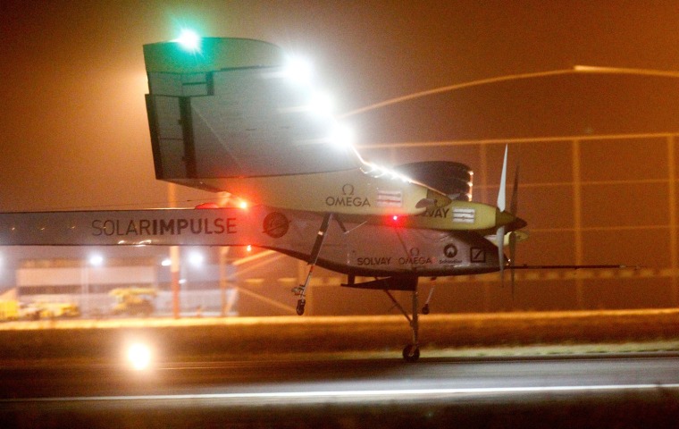 An experimental solar-powered plane, Solar Impulse, approaches to make a night landing at Rabat airport, Morocco on Tuesday.