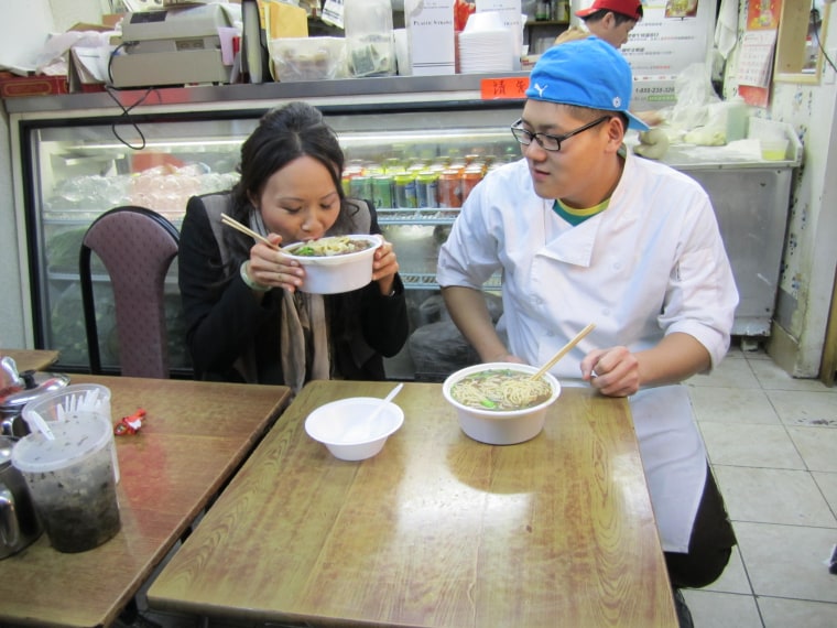 Ching-He Huang slurps up some delicious eats.