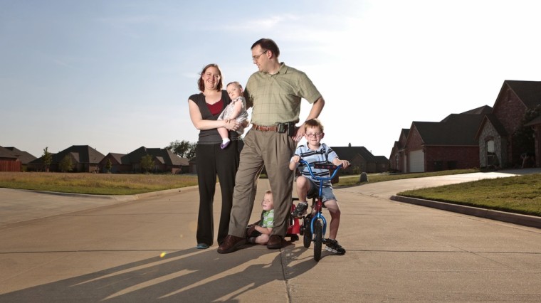 Dustin Baylor and his family on in Enid, Okla. Baylor is among a new generation of dads trying to 'do it all.'