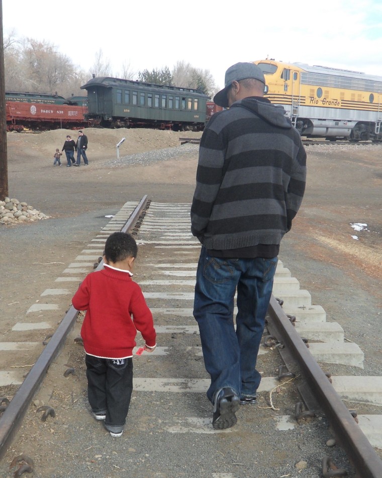Dad and Omar, 4, spend the day at a railway museum.