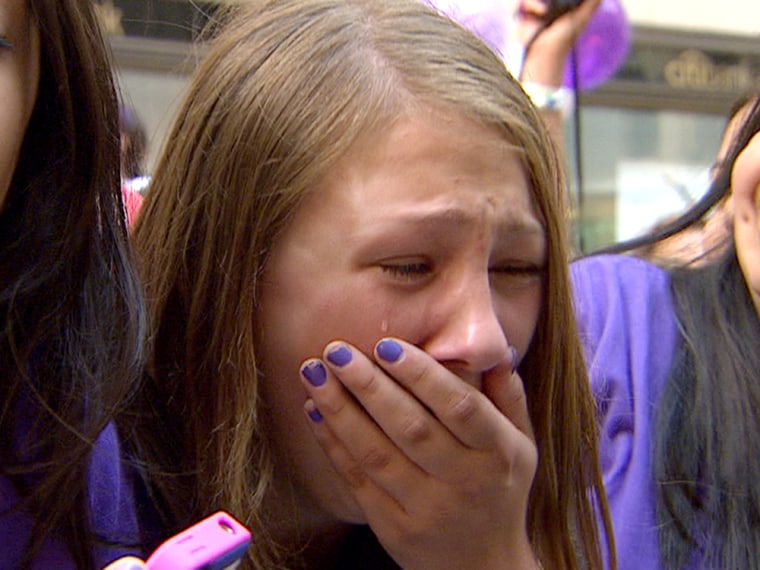 A Justin Bieber fan gets hysterical at the concert.