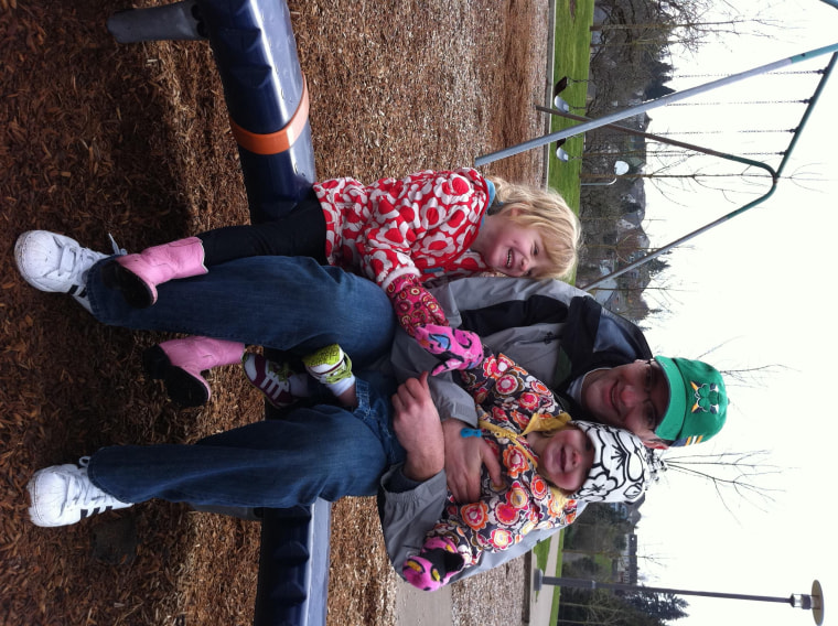 Brooke, 6, and Reese, 3, snuggling with Dad in the Pacific Northwest.