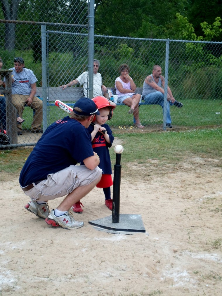 Madison with her favorite T-ball coach: daddy!