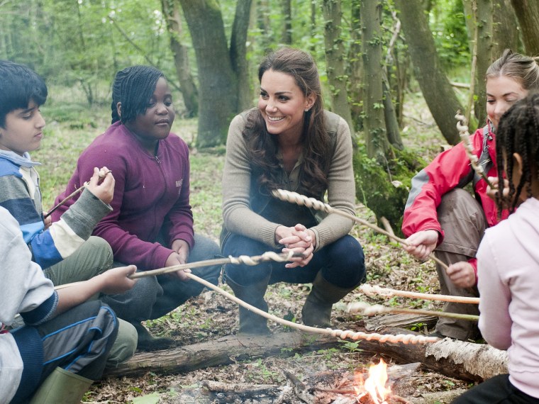 Marshmallow, anyone? Duchess Kate, clad in a casual ensemble, reportedly made a few young friends while on a charity visit at a campsite in Wrotham, Kent on June 17.