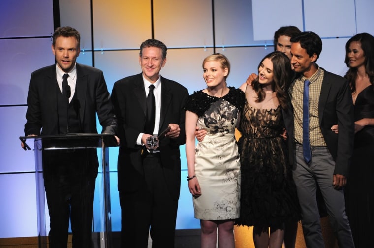 Actors Joel McHale, producer Russ Krasnoff, Gillian Jacobs, Alison Brie and Danny Pudi of \"Community\" accept the award for Best Comedy Series from presenter Emily Deschanel onstage during The Broadcast Television Journalists Association Second Annual Critics' Choice Awards in Beverly Hills on Monday.