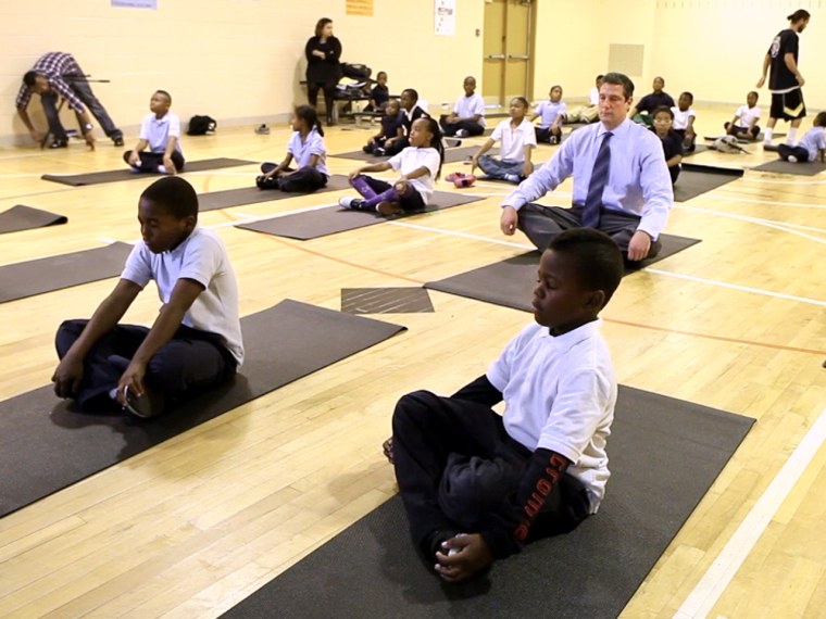 Rep. Tim Ryan, D-OH, practices meditation with kids at Robert Coleman Elementary School in Baltimore.