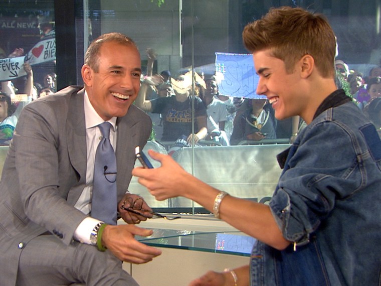 Old pals: Justin Bieber sends out the first tweet from Matt Lauer's newly minted Twitter account on Friday.
