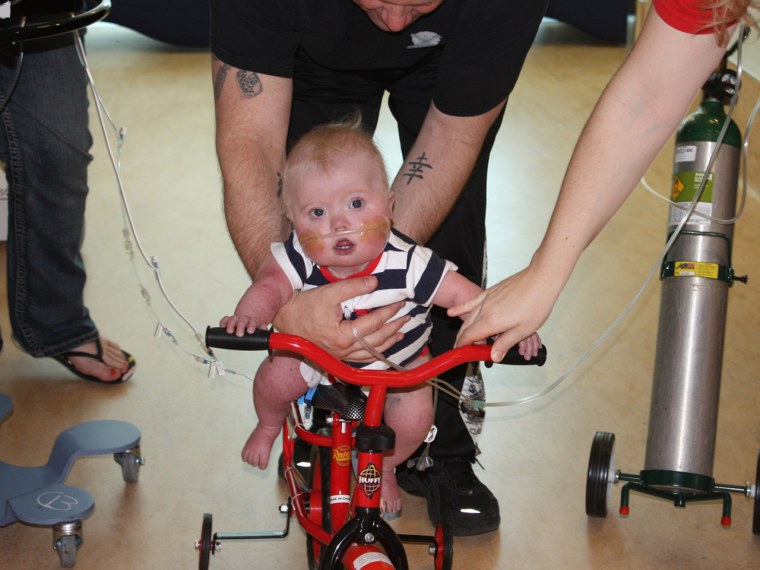 Ryan Roberts' parents put together a \"bucket list\" for their very ill 21-month-old son, which included riding a bike.