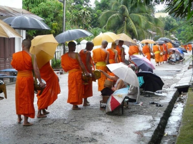 Monks collecting alms in Luang Prabang, Laos