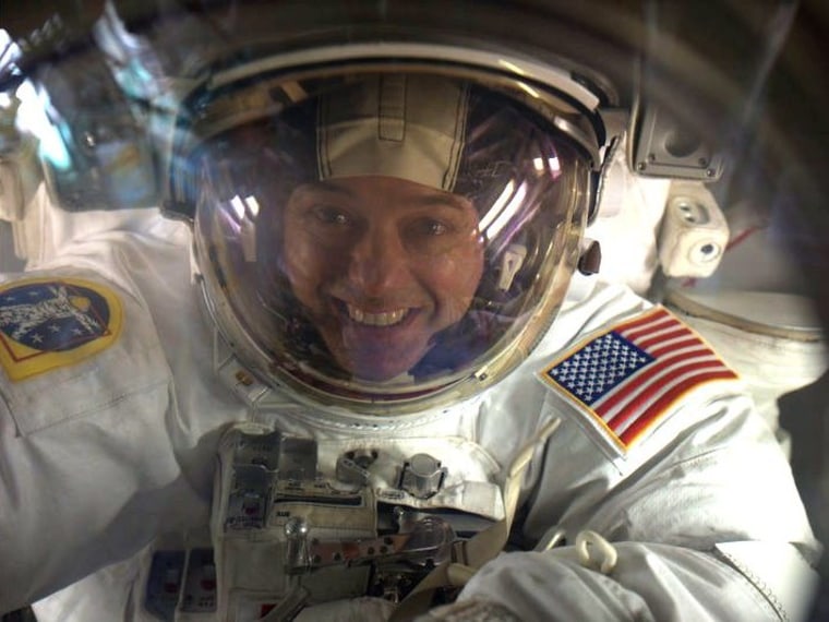 NASA astronaut Ron Garan looks into the camera from outside the International Space Station in July 2011.