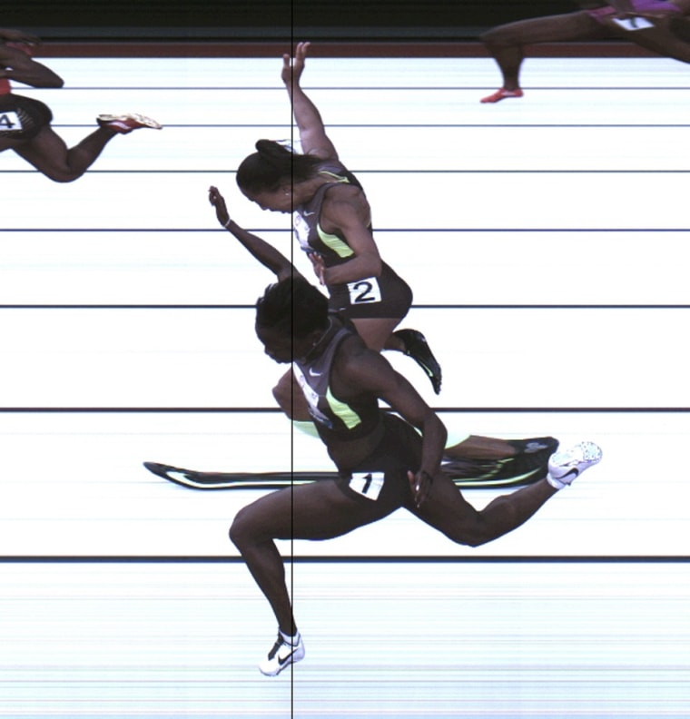 This Saturday, June 23, 2012, photo provided by USA Track & Field shows the third-place finish of the women's 100-meter final from a photo-finish camera, shot at 3,000-frames-per-second, during the U.S. Olympic Track and Field Trials in Eugene, Ore. Allyson Felix and Jeneba Tarmoh, in foreground, finished in a dead heat for the last U.S. spot in the 100 to the London Games, each leaning across the finish line in 11.068 seconds.