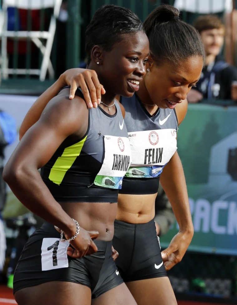 Allyson Felix puts her arm around Jeneba Tarmoh after the two runners tied for third place in the women's 100m race at the U.S. Olympic athletics trials in Eugene, Oregon, June 23.