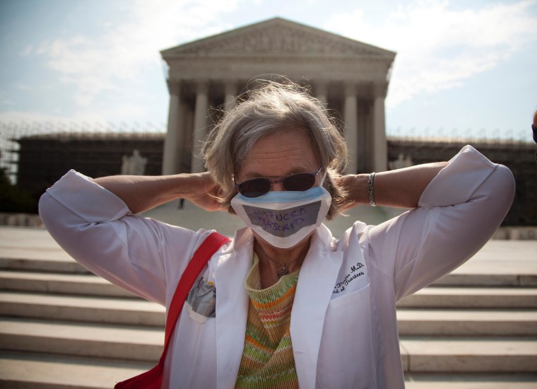 A demonstrator outside of the Supreme Court this morning.