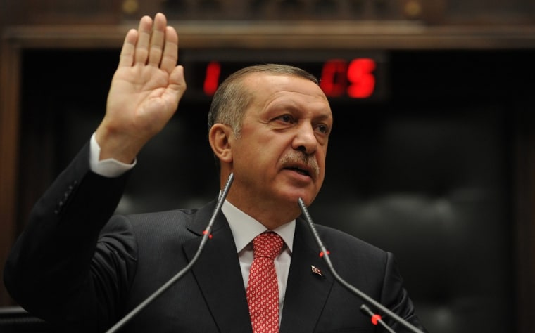 Turkey's Prime Minister Recep Tayyip Erdogan addresses members of parliament from his ruling AK Party during a meeting at the Turkish parliament in Ankara, Turkey, on Tuesday.