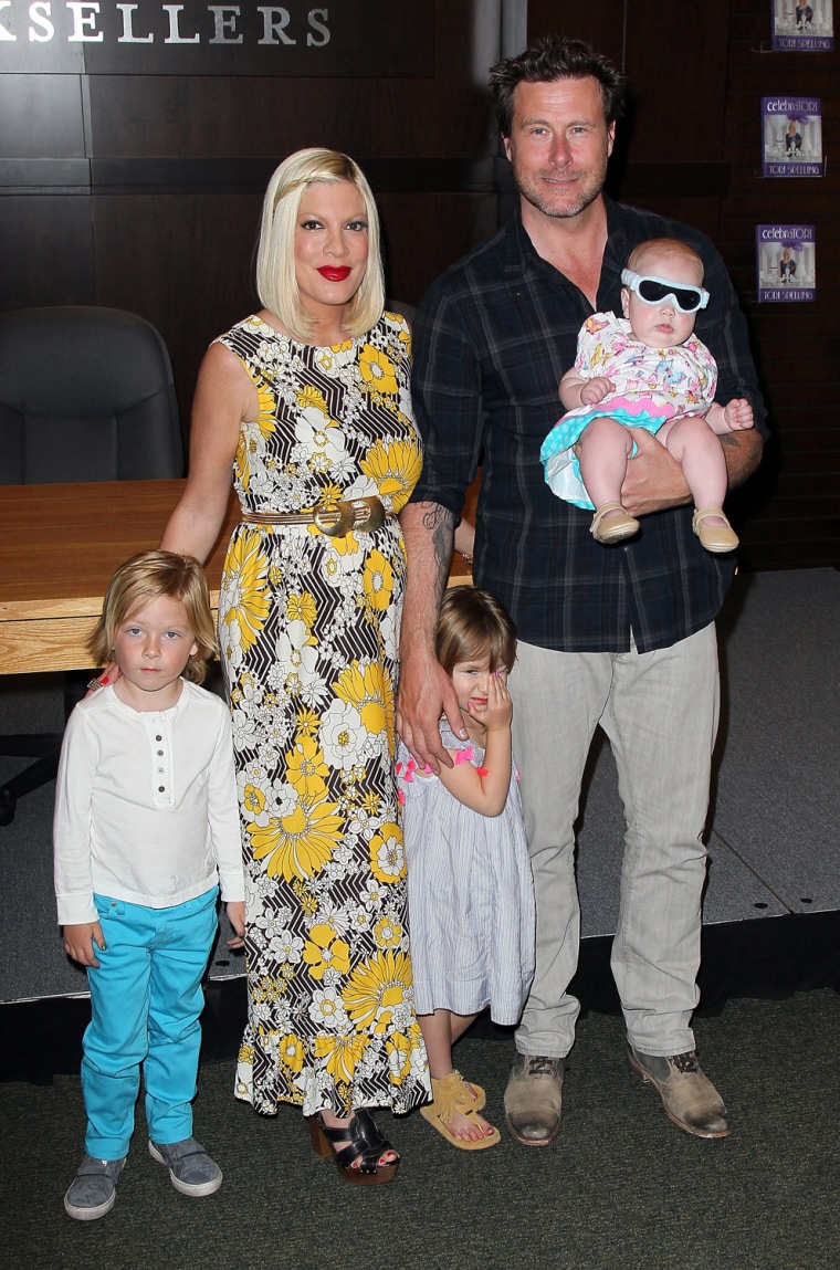 Tori Spelling and husband actor Dean McDermott pose with their children (L-R) Liam, Stella and Hattie.