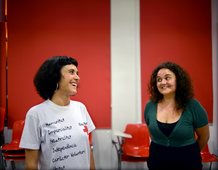 Aida Abello and Ester Soto work at a Red Cross homeless shelter in Terrassa, Spain.