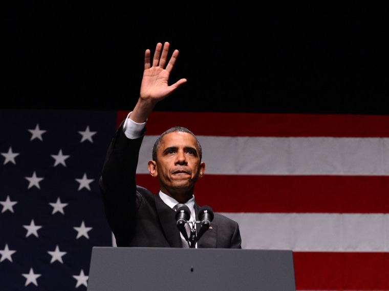 President Barack Obama waves at supporters after speaking at Obama Victory Fund concert in Miami, Fla.