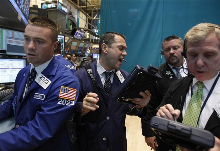 Traders work on the floor of the New York Stock Exchange.