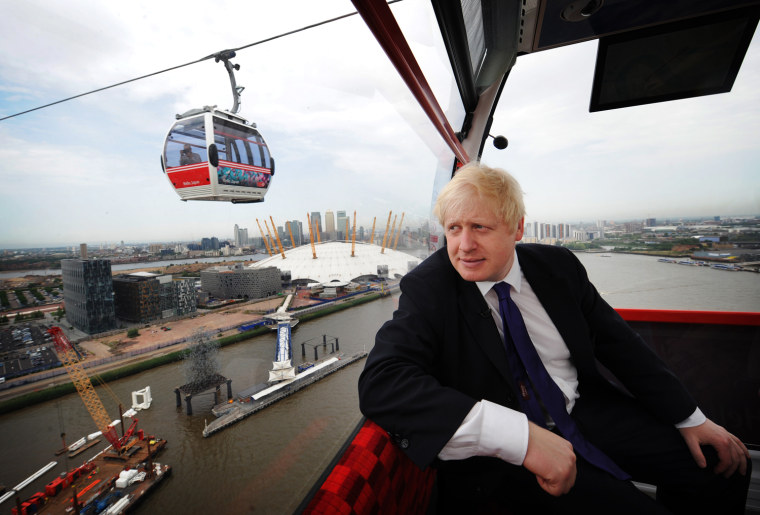 London Mayor Boris Johnson takes one of the first rides on the Emirates Air Line cable car across the River Thames prior to its official opening to the public this morning on June 28 in London, England.