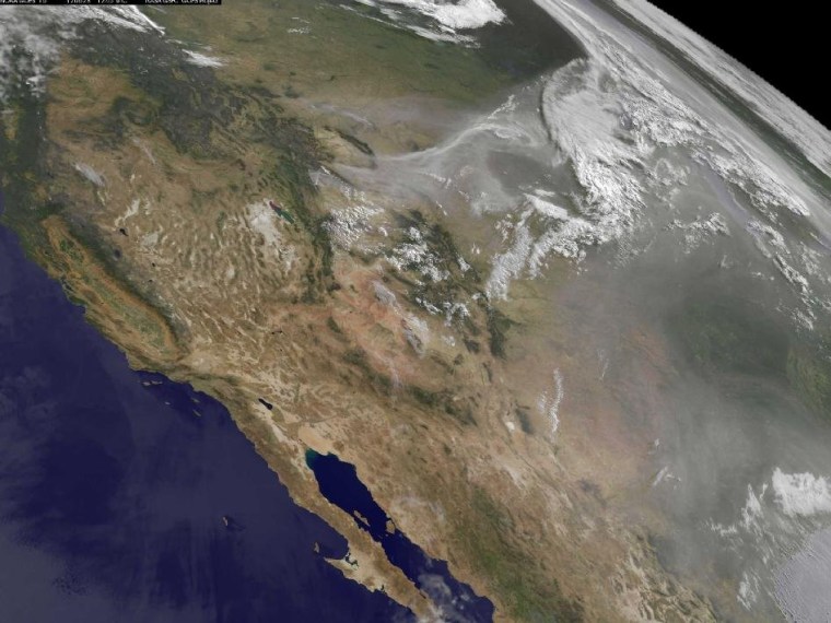 The GOES-15 satellite keeps a stationary eye over the western United States. Smoke from the fires raging in several states has created a brownish-colored blanket over the entire region.