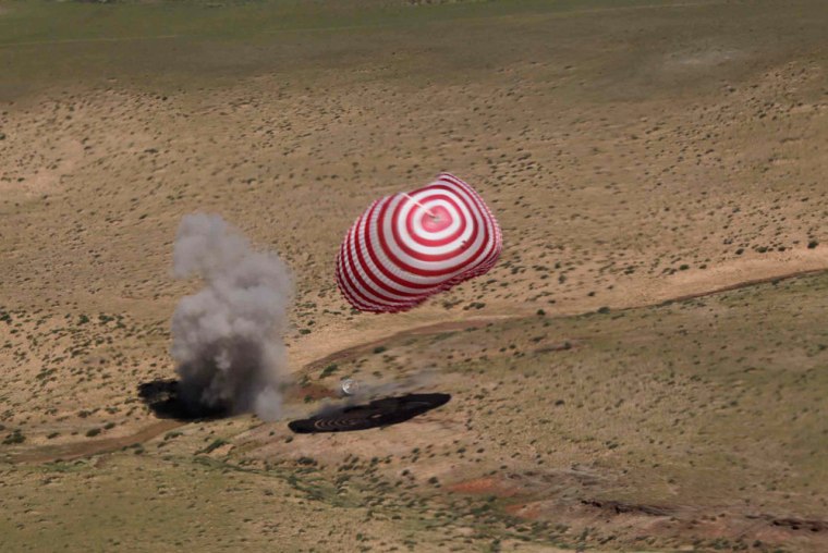 the re-entry capsule of China's Shenzhou-9 spacecraft lands safely in Siziwang Banner of north China's Inner Mongolia Autonomous Region on Friday.