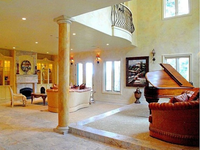 Marble floors and columns dominate the interior of the home.