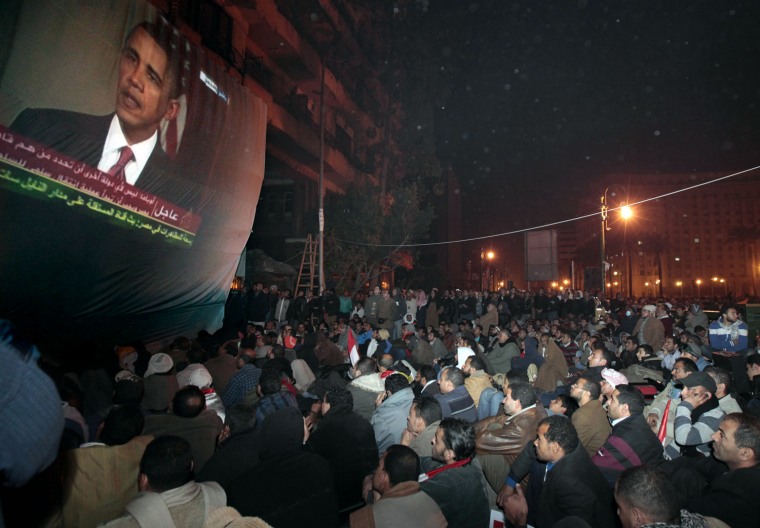 Egyptian anti-government protesters gathered in Cairo's Tahrir Square to watch a screen showing U.S. President Barack Obama live on a TV broadcast from Washington DC, speaking about the situation in Egypt on Feb. 2, 2011, in the midst of the revolution.