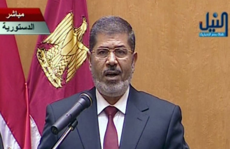 An image grab taken from Egypt's Nile TV shows Egyptian President Mohamed Morsi taking the oath of office during a swearing-in ceremony at the Constitutional Court in Cairo Saturday.
