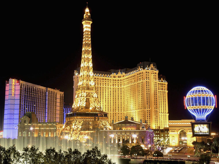 LAS VEGAS - JUNE 30:  Water from the Bellagio's fountain show is seen in front of the Bally's Las Vegas (L) and Paris Las Vegas, including the Paris' 50-story Eiffel Tower replica, June 30, 2005 in Las Vegas, Nevada.  (Photo by Ethan Miller/Getty Images)