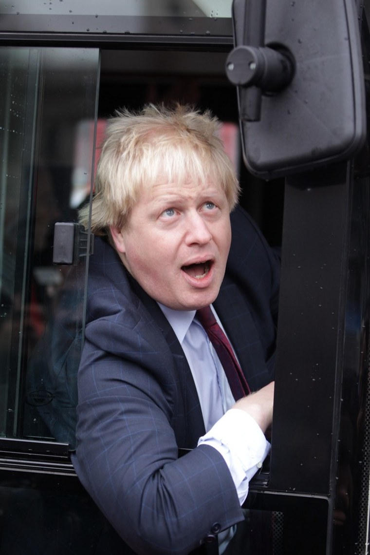 LONDON, ENGLAND - DECEMBER 16: London Mayor Boris Johnson sits in the driver's seat of a new prototype red double decker bus in Trafalgar Square on December 16, 2011 in London, England. The new bus design mimics some of the features of the iconic red London Routemaster bus and is scheduled to come into service in 2012. The original Routemaster was introduced in 1956 and a number of them are still in use on heritage routes in London, following their withdrawal from regular routes in 2005. (Photo by Peter Macdiarmid/Getty Images)