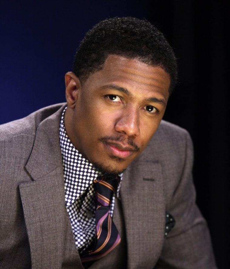 FILE - In this May 12, 2011 file photo, entertainer Nick Cannon poses for photos after an interview, in New York.  Cannon has been transferred to a Los Angeles hospital to continue treatment for \"mild kidney failure.\" His representative says the 31-year-old Cannon was moved Wednesday, Jan. 4, 2012, after receiving treatment in Aspen, Colo., where he and his wife, Mariah Carey, had been vacationing. (AP Photo/Richard Drew, file)