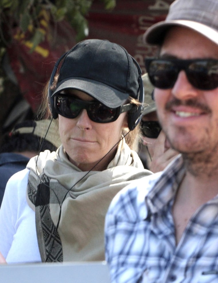 Oscar winning director Kathryn Bigelow, left, stands on the sets during the shooting for her upcoming film about Osama bin Laden in Chandigarh, India.