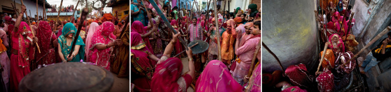 Indian Hindu women from Nandgaon village beat the shield of a man from Barsana during Lathmar Holi in Nandgaon, India, March 3.