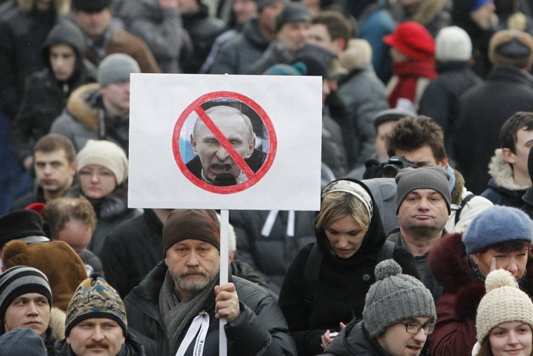 Opposition supporters gather before a protest demanding fair elections in central Moscow March 5, 2012. International monitors said Russia's presidential election was clearly skewed to favour Vladimir Putin, a verdict that could spur protesters planning to take to the streets to challenge his right to rule. REUTERS/Denis Sinyakov (RUSSIA - Tags: POLITICS ELECTIONS CIVIL UNREST)