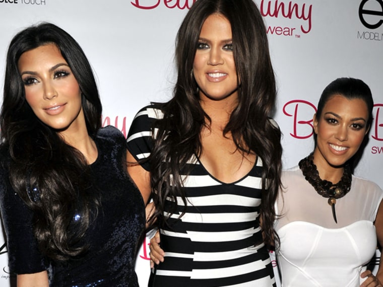 LOS ANGELES, CA - APRIL 27: Kim Kardashian, Khloe Kardashian and Kourtney Kardashian pose for a picture at the Beach Bunny Swimwear's grand opening party on April 27, 2010 in Los Angeles, California. (Photo by Toby Canham/Getty Images)