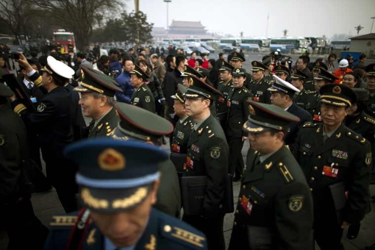 Military delegates arrive for the opening session of the annual National People's Congress at the Great Hall of the People in Beijing, China, Monday, March 5, 2012. (AP Photo/Alexander F. Yuan)