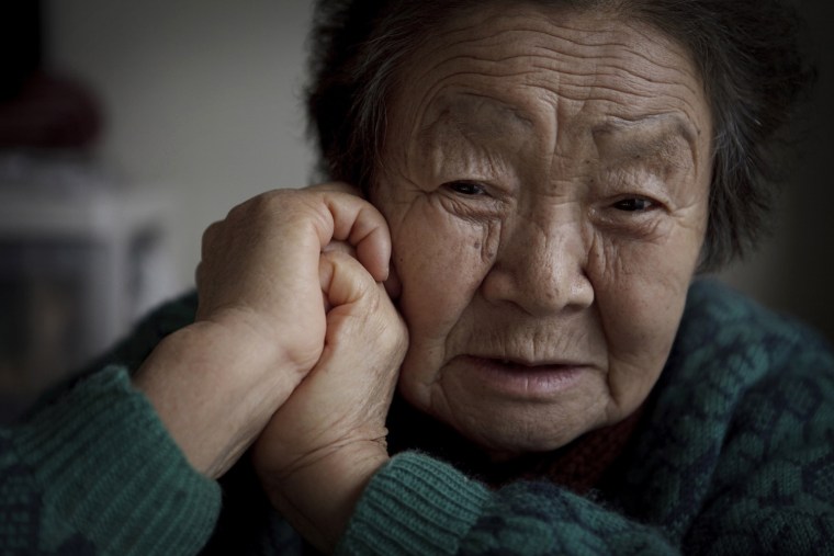 Fukuko Hatakeyama, 81, poses at her temporary house in Kesennuma, Miyagi, Japan on Feb 6, 2012. Massive tsunami hit northern Japan on March 11, 2011 sweeping away her house and all her belongings, including cash savings. Photo by Kuni Takahashi