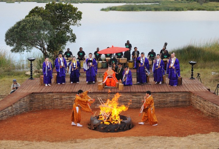 Japanese Buddhist Shinnyo-en priests light a ceremonial fire at the Gallmann nature conservancy.