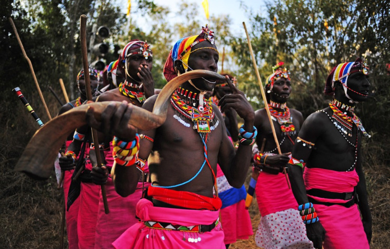 A Njemps tribesman blows a horn at the Gallmann nature conservancy.